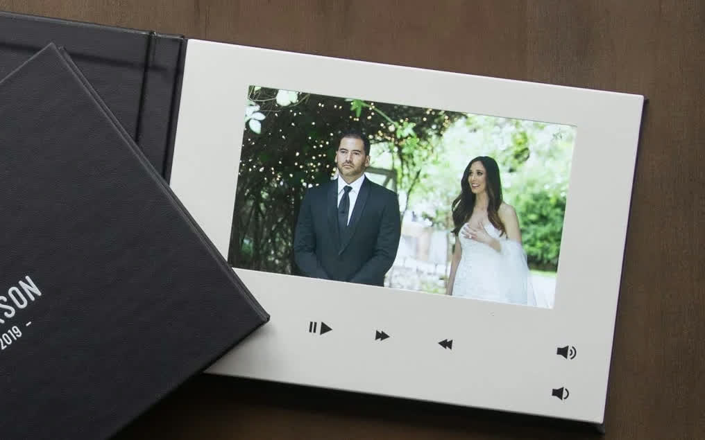 Video playbook open and playing a wedding film
