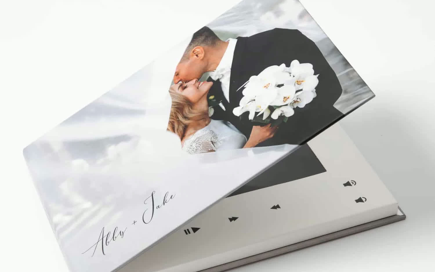 Customized wedding video playbook with the couple's photo on the cover